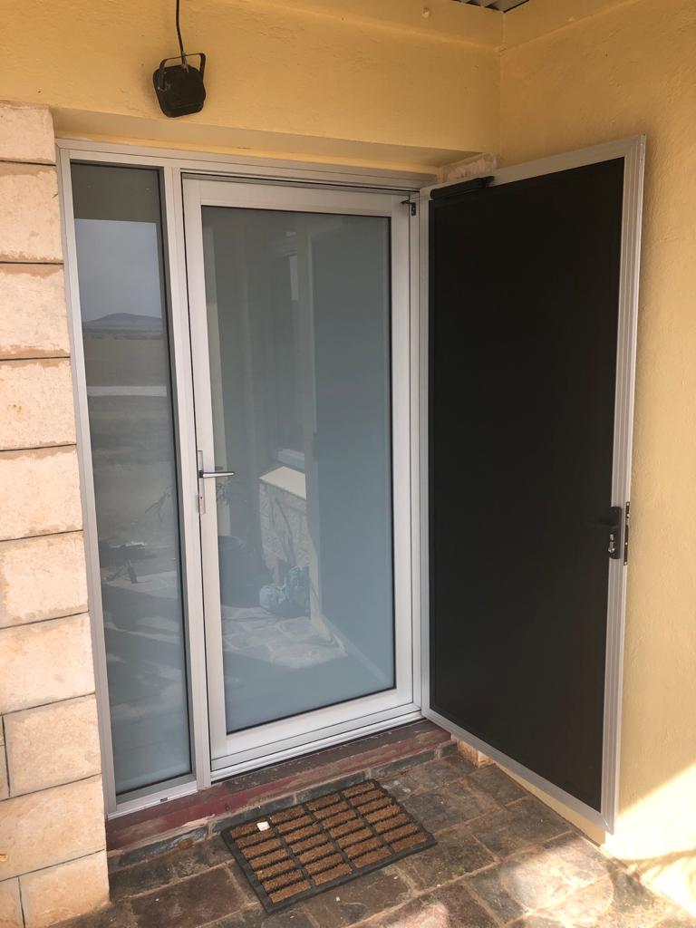 Nu-View Aluminium Windows, Doors & Glass - Clear Anodised White Translucent Glass Door