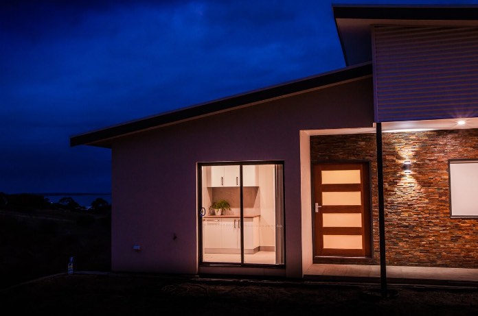 Nu-View Aluminium Windows, Doors & Glass - Sliding Doors at Night